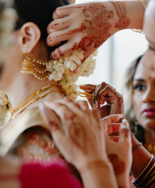 Bride and groom during traditional Indian wedding ceremony, planned and designed by DELSIE, event planners Miami Florida.