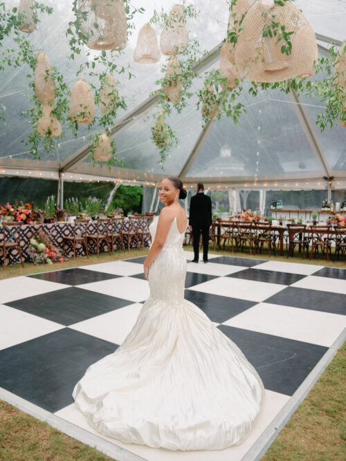 Clear-top tent at Lamberts Cove Inn wedding, showcasing lush florals, elegant tablescapes, and panoramic views of Martha’s Vineyard.