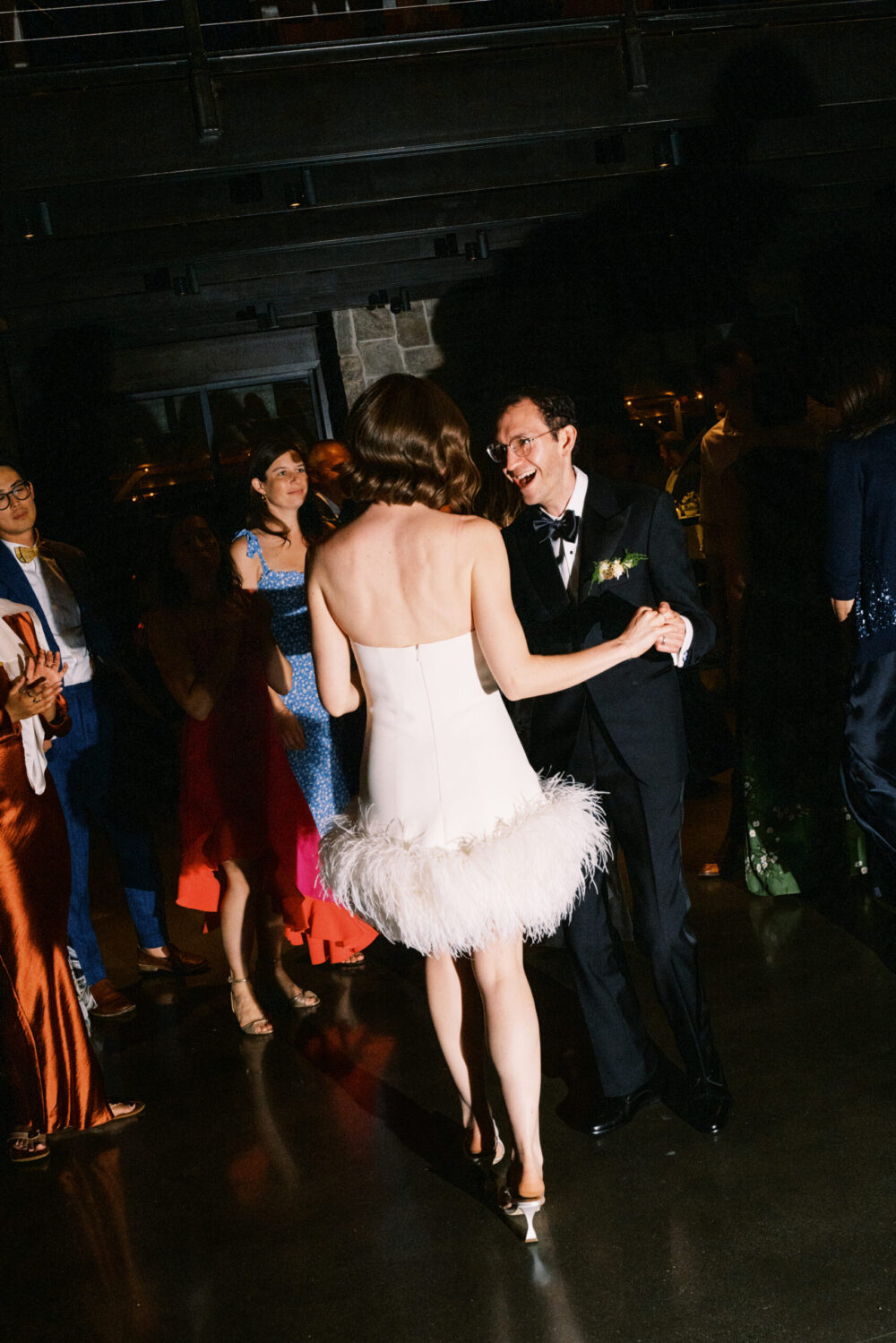 Bride and groom dancing with guests during Kingdom of the Hawk wedding reception in Connecticut.