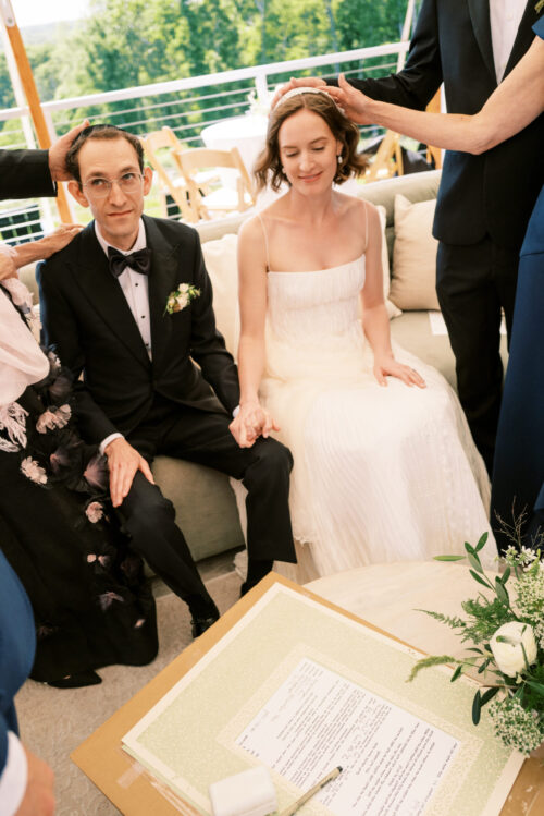 Bride and groom exchange vows at Kingdom of the Hawk wedding ceremony in Connecticut vineyard.