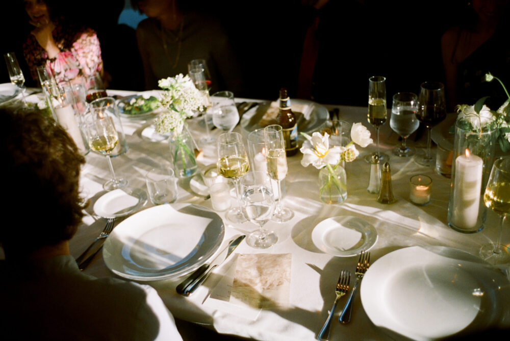 Reception tables with elegant place settings at Kingdom of the Hawk wedding.